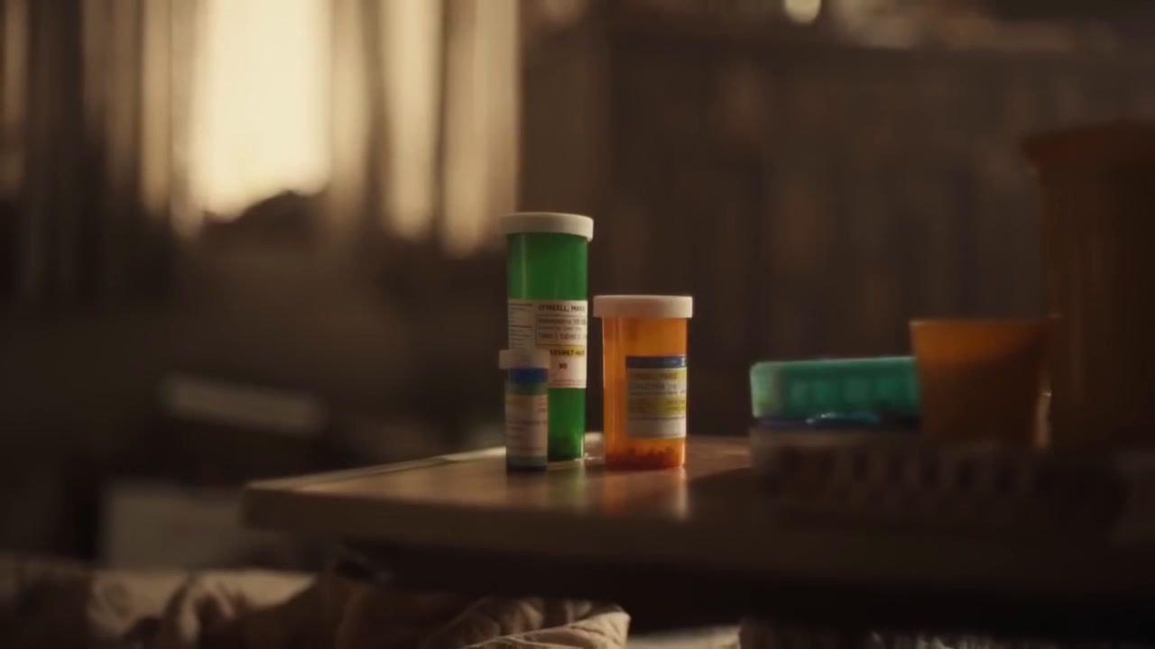 a table topped with three bottles of pills