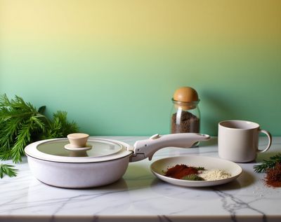 a table topped with bowls of food and a tea pot