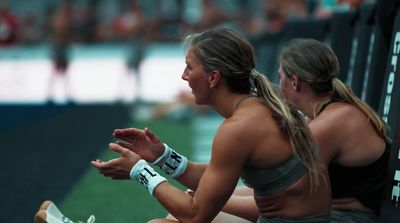 a couple of women sitting next to each other