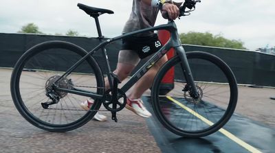 a man riding a bike on top of a ramp