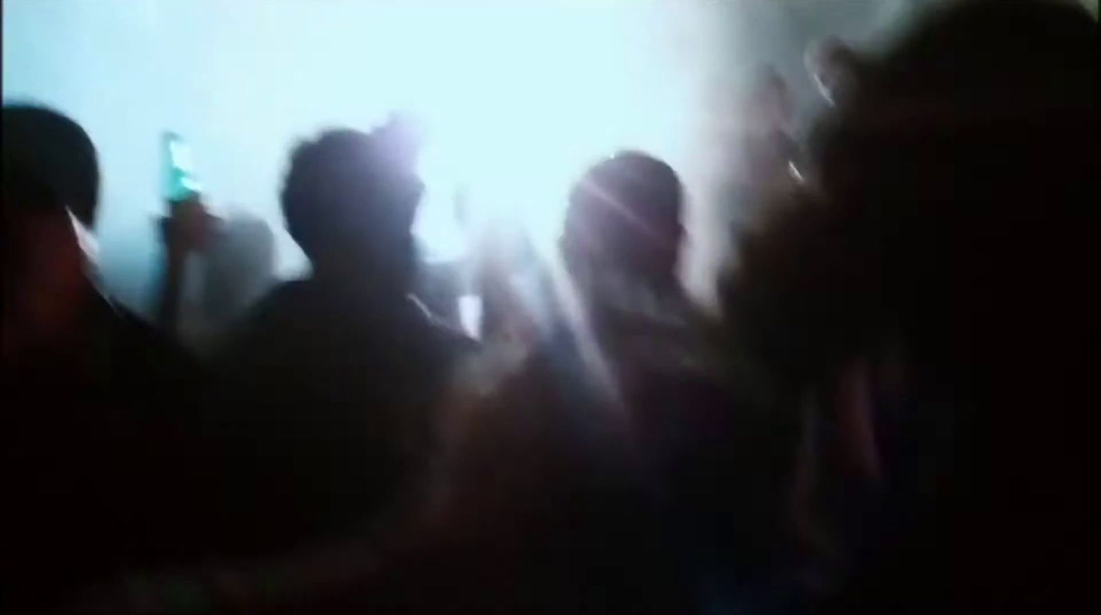 a blurry photo of a group of people at a concert