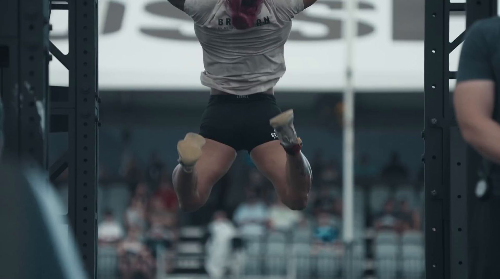 a man jumping in the air in a gym