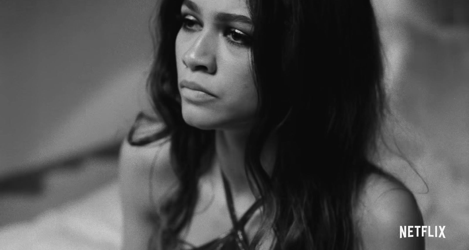 a black and white photo of a woman with long hair