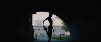 a person doing a handstand in a tunnel