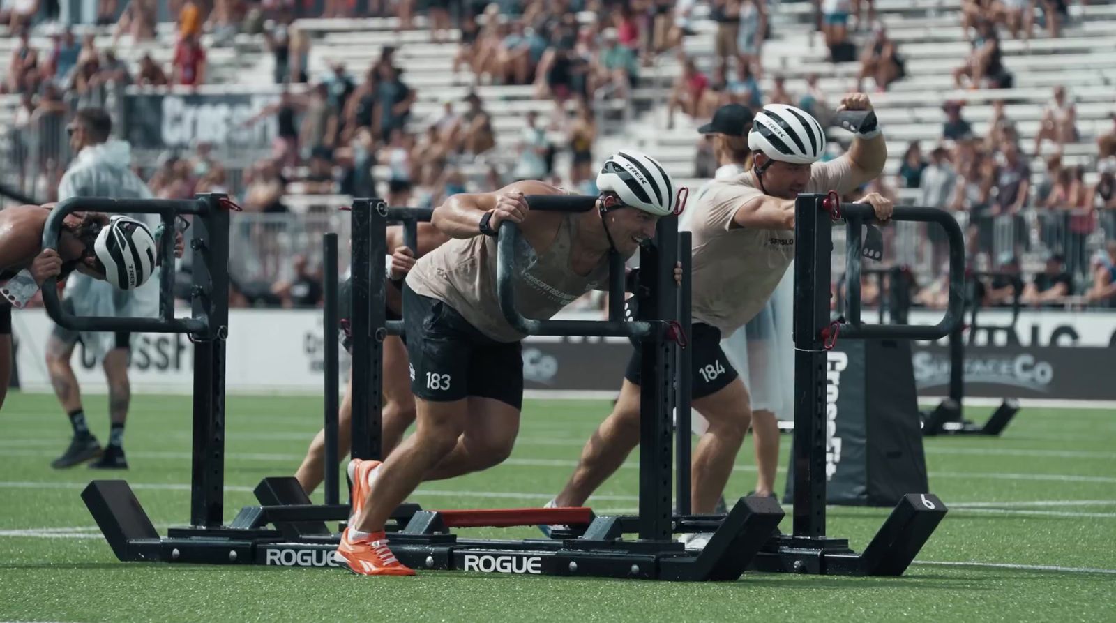 a group of men working out on a field