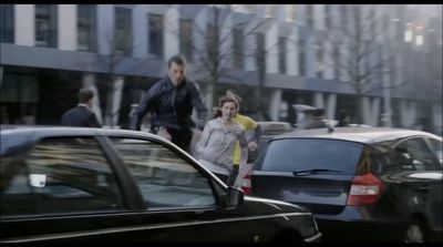 a man and a woman walking down a street