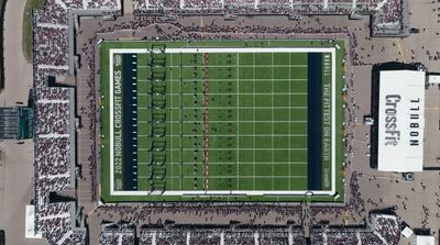 an aerial view of a football field in a stadium