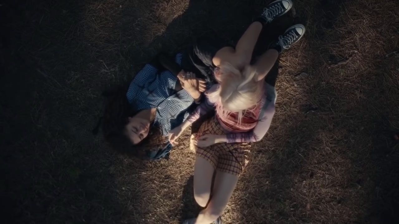 a man and a woman laying on the ground