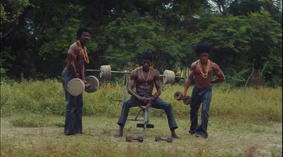 a group of men standing next to each other in a field