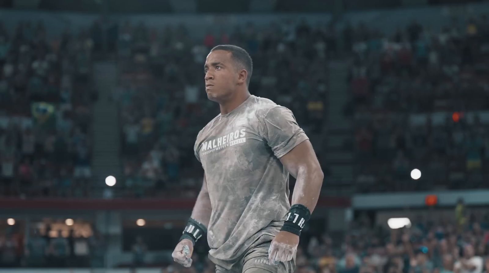 a man standing in front of a crowd in a stadium