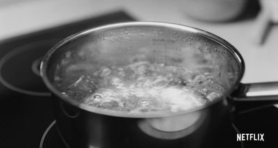 a pot filled with boiling water on top of a stove