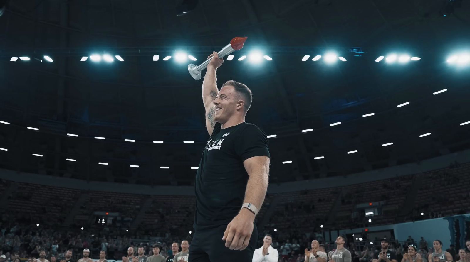 a man holding a tennis racquet on top of a tennis court