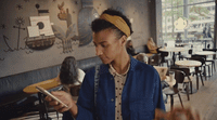 a woman looking at a tablet in a restaurant