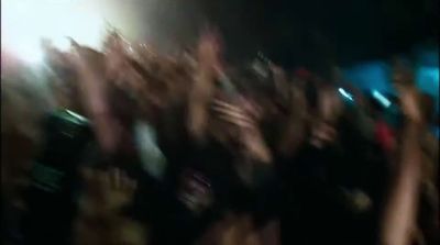 a blurry photo of a crowd of people at a concert