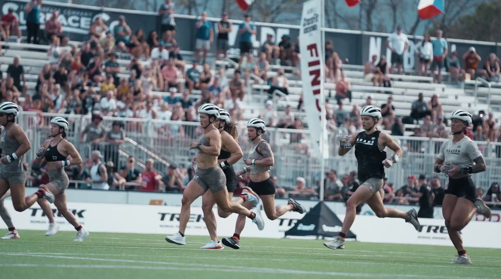 a group of women running across a field