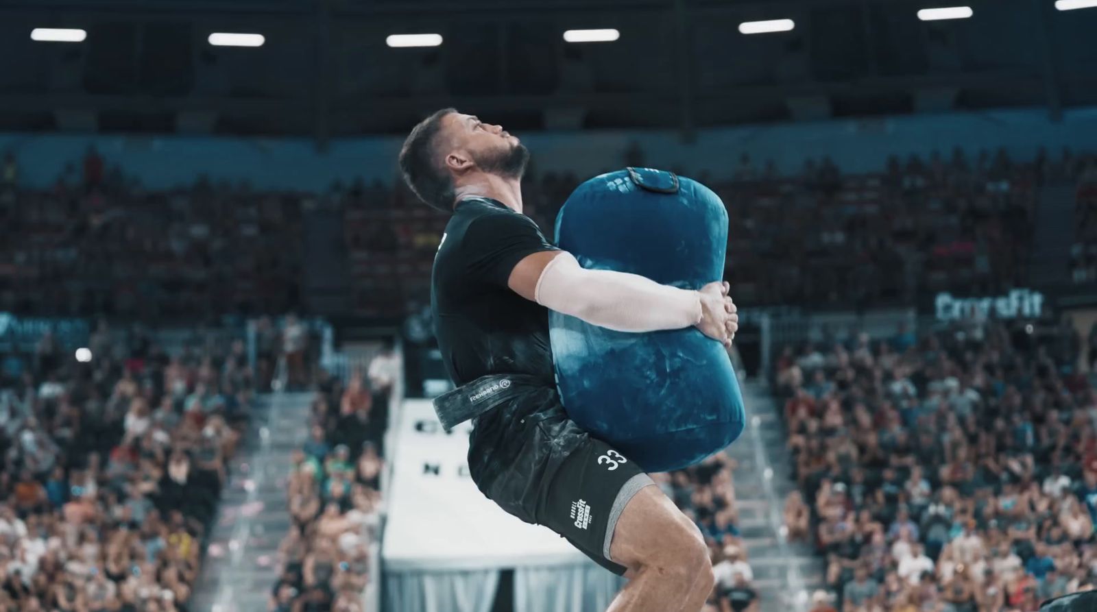 a man is doing a trick on a large pillow