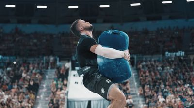 a man is doing a trick on a large pillow