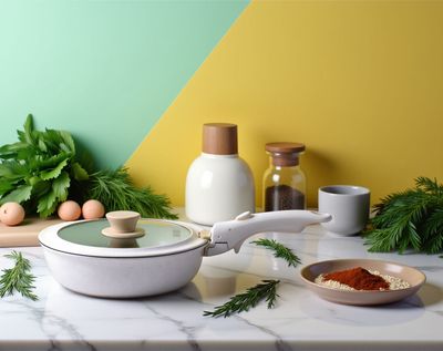 a table topped with a bowl of food and a bowl of spices
