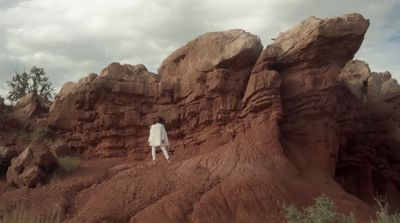 a person standing on a rocky outcropping