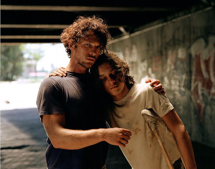 a couple of men standing next to each other