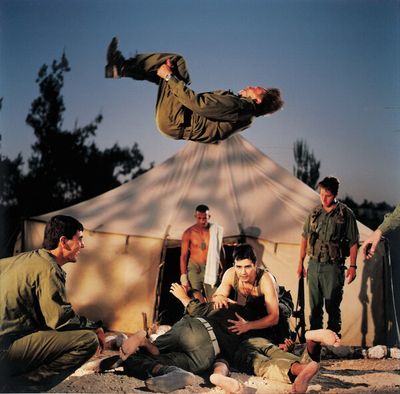 a man flying through the air while riding a skateboard