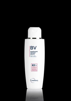 a bottle of shampoo on a black background