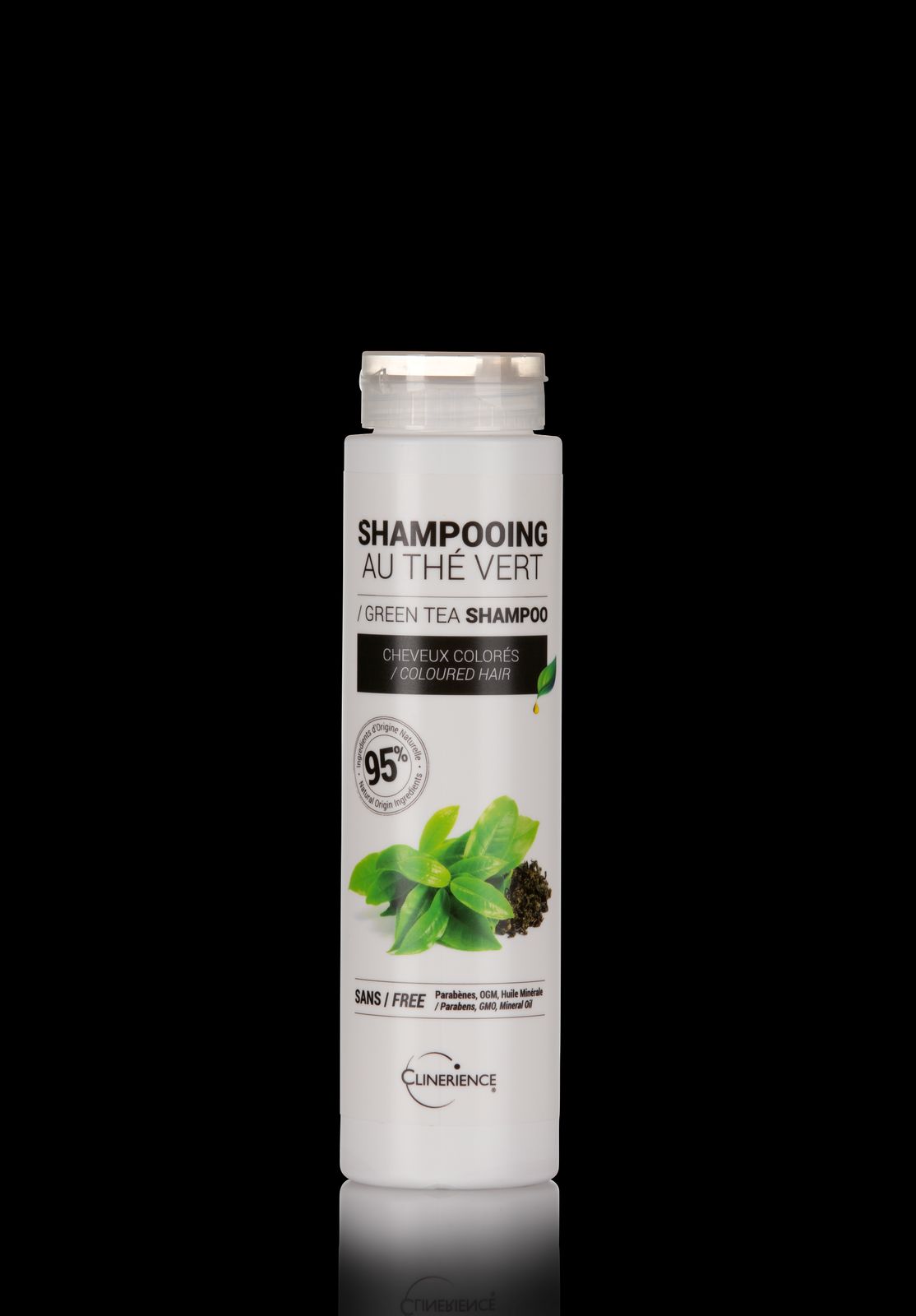 a bottle of shampooing on a black background
