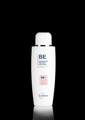 a bottle of be shampoo on a black background