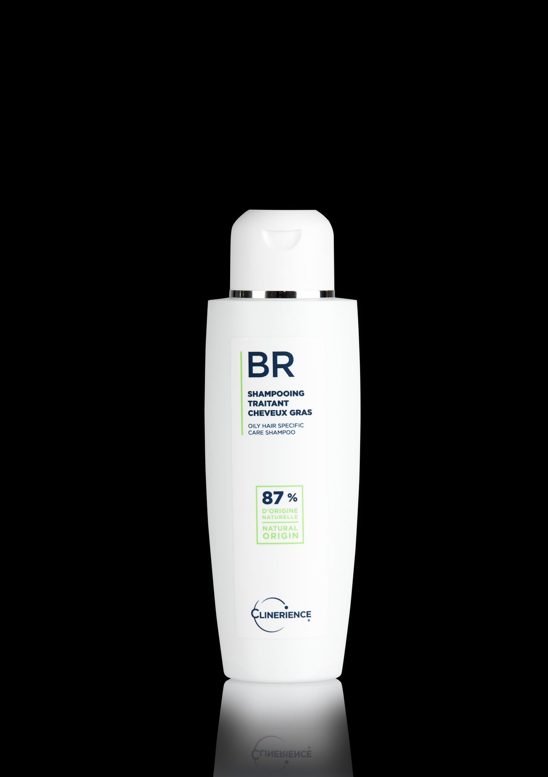 a bottle of shampoo on a black background