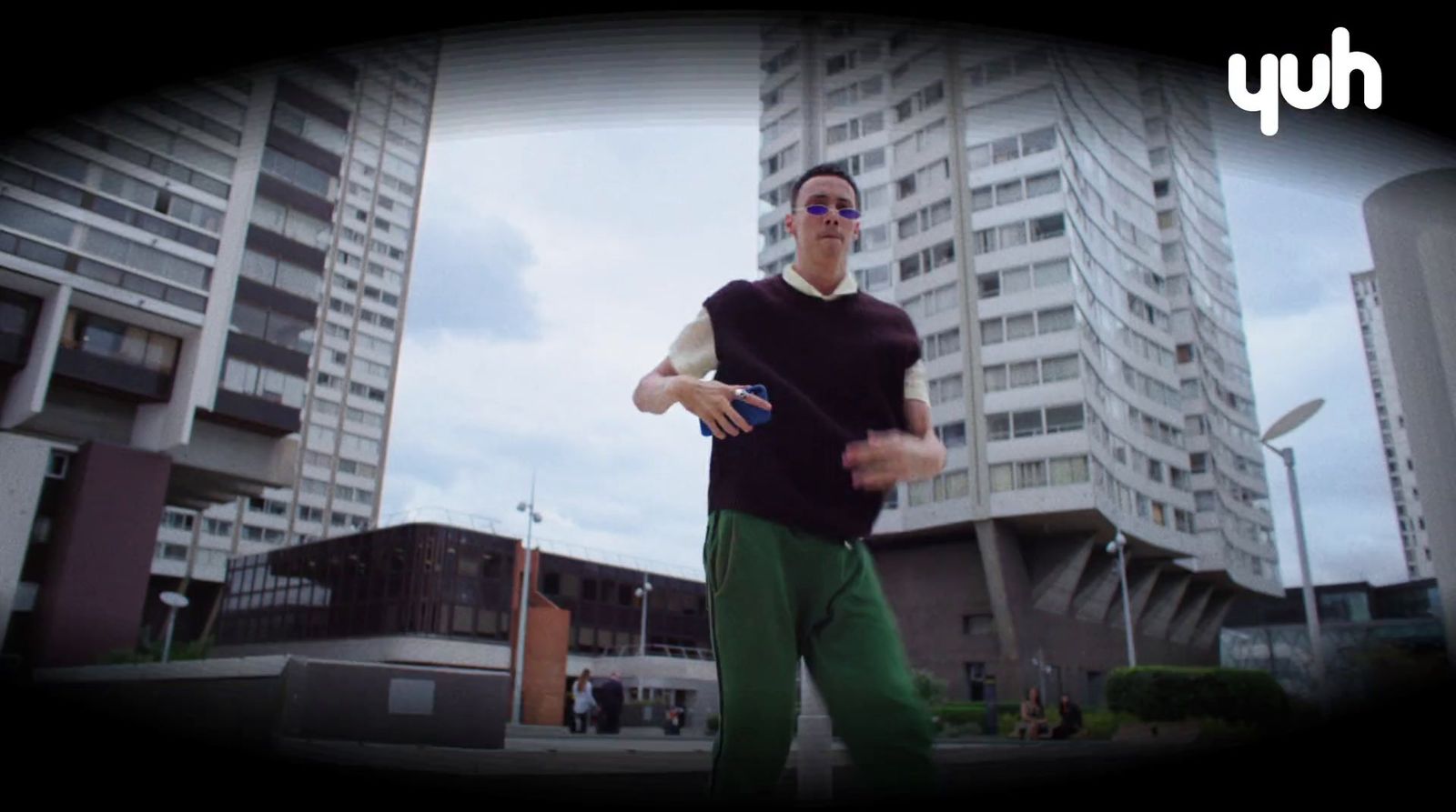 a man standing in front of a tall building