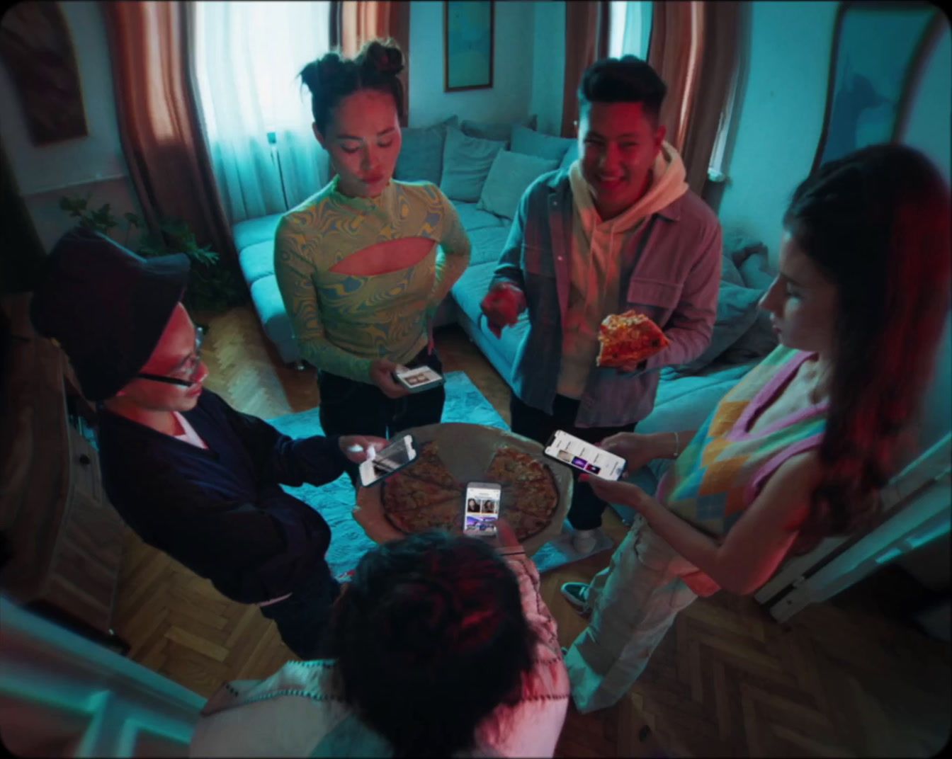 a group of people standing around a table