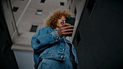 a woman taking a picture with her cell phone