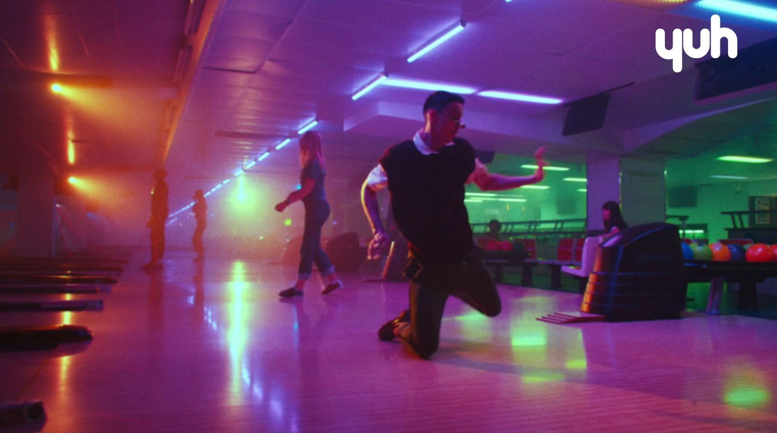 a group of people playing a game of bowling