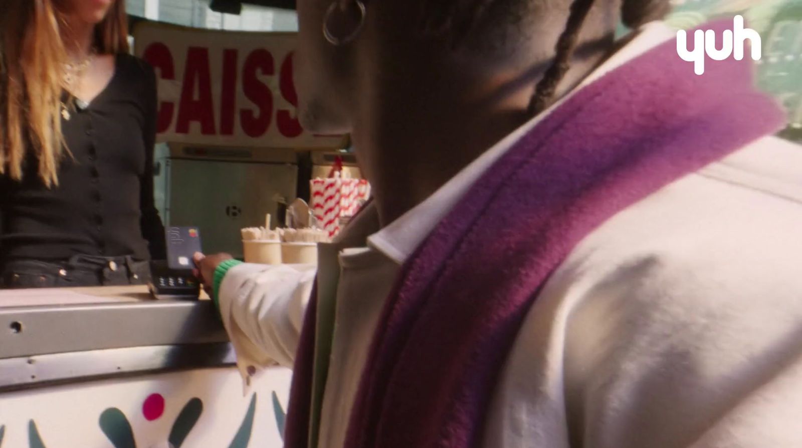 a woman standing behind a counter in a store