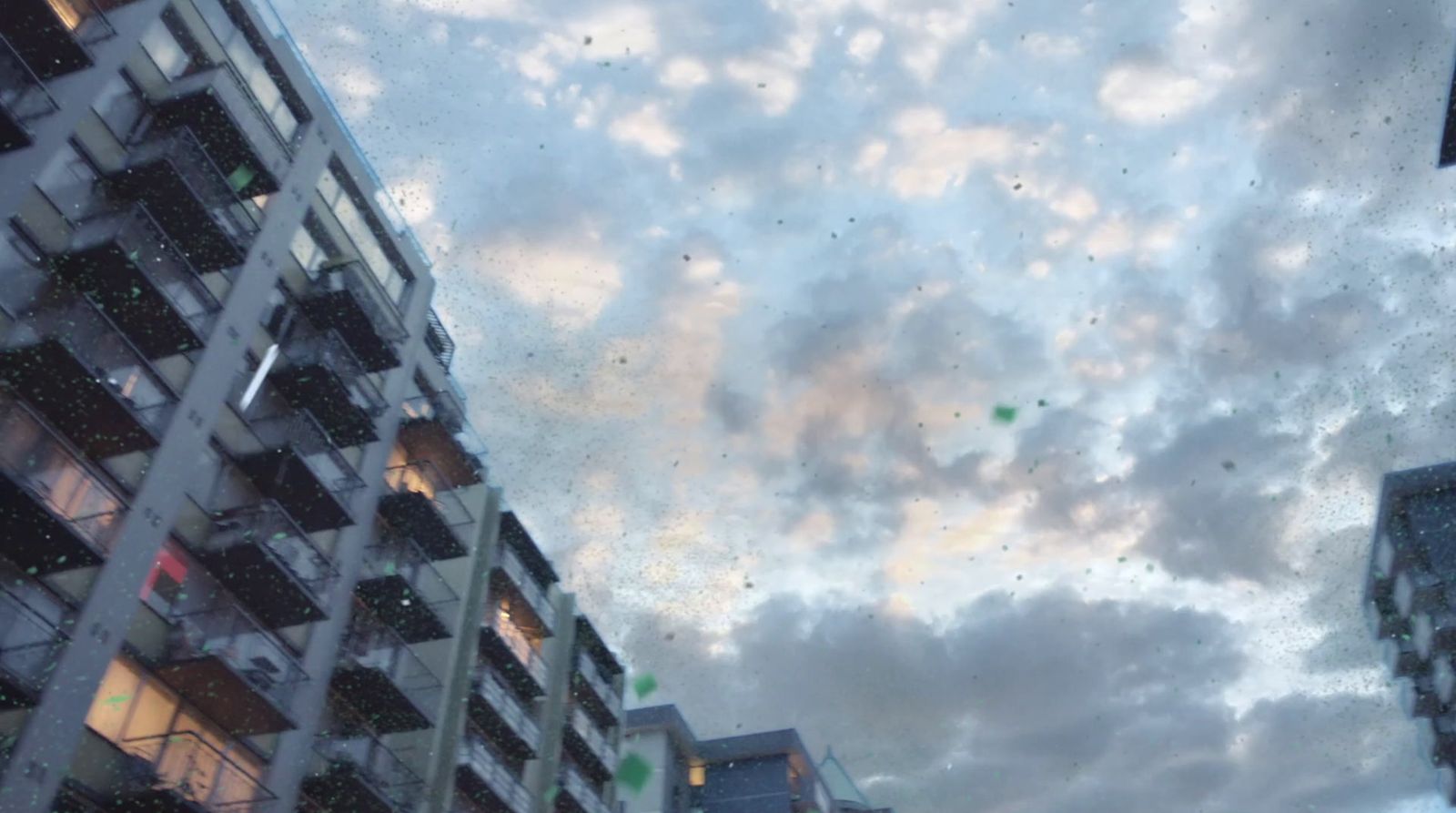 a view of a cloudy sky from a high rise building