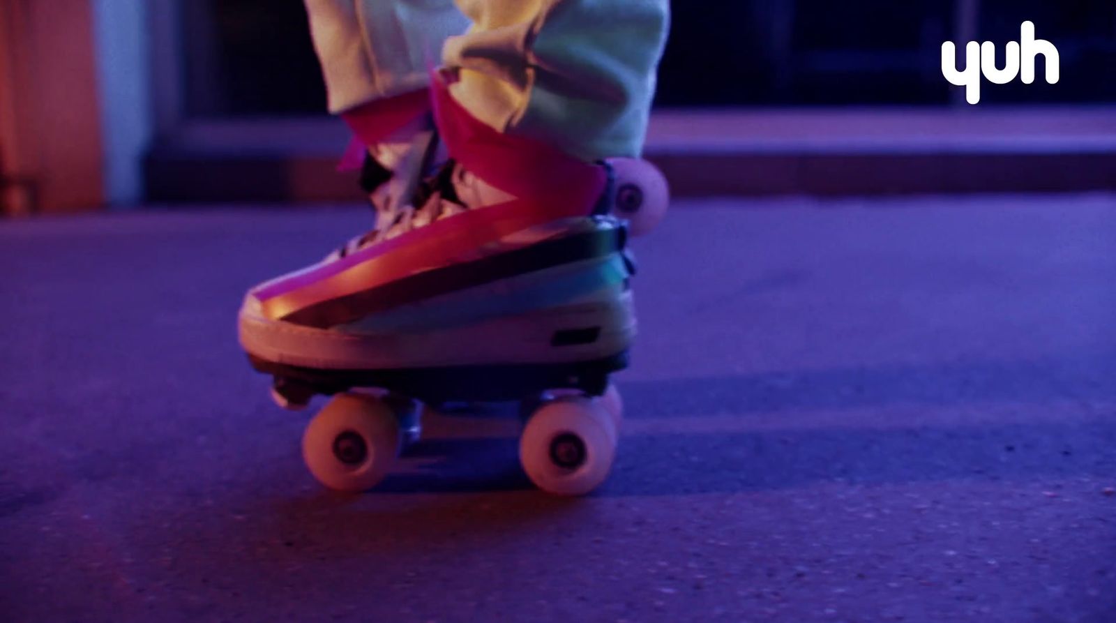 a person riding a skateboard down a street