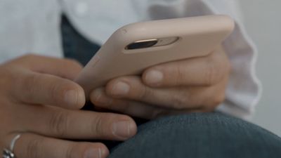 a close up of a person using a cell phone