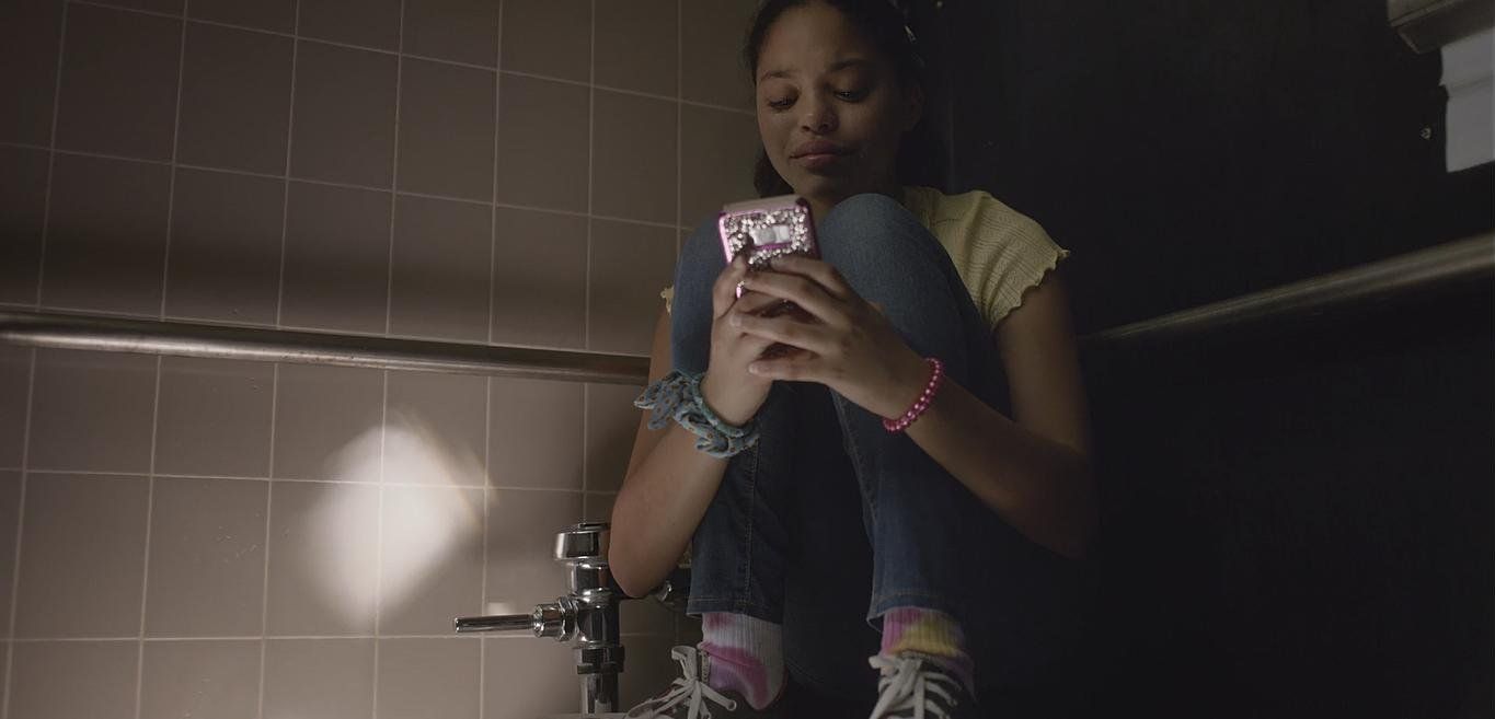 a woman taking a picture of herself in a mirror