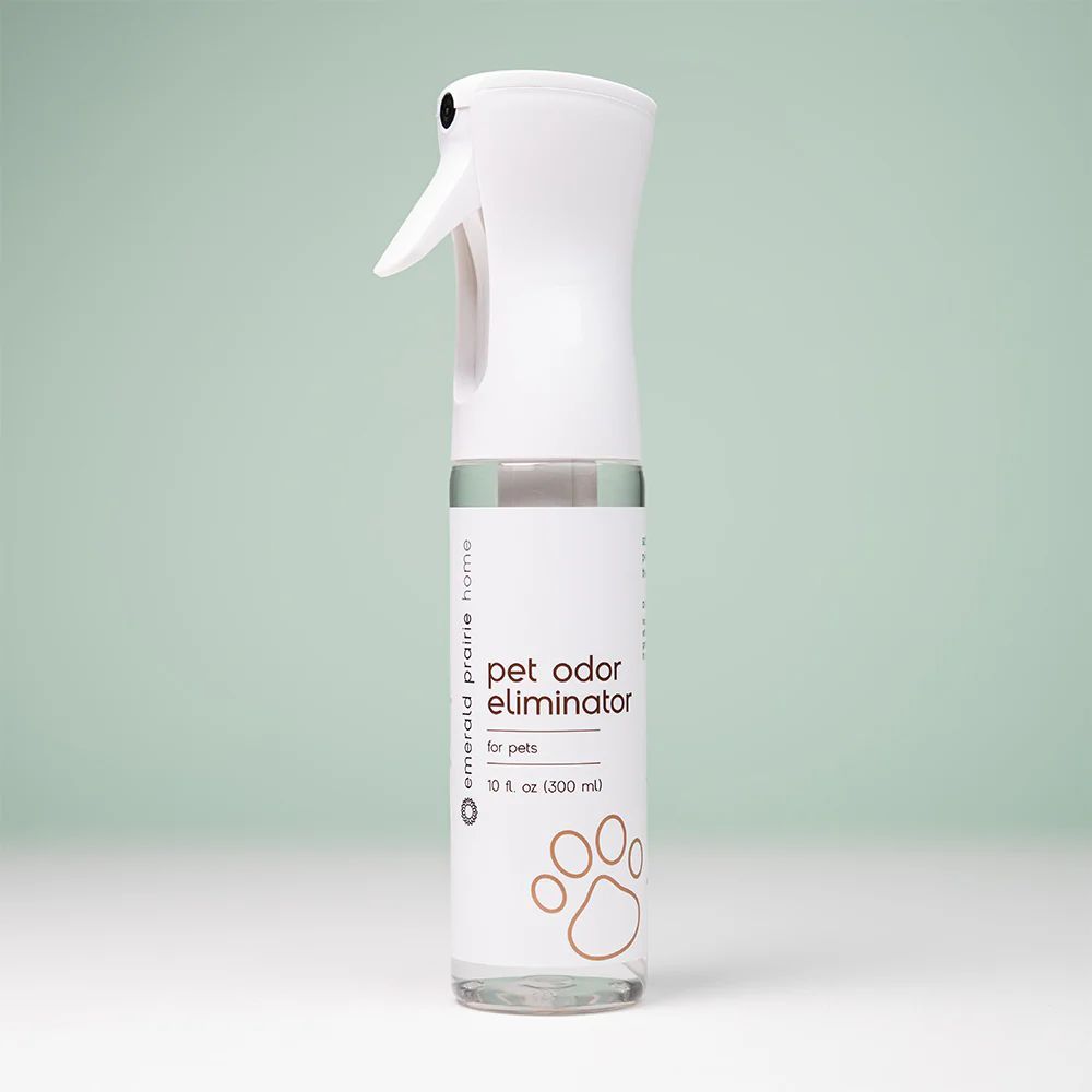 a bottle of pet odor eliumiator sitting on a table