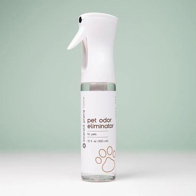 a bottle of pet odor eliumiator sitting on a table