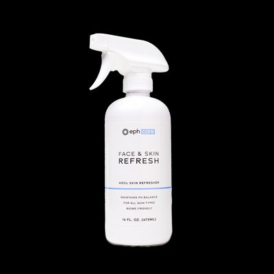 a bottle of face and skin refresh on a black background