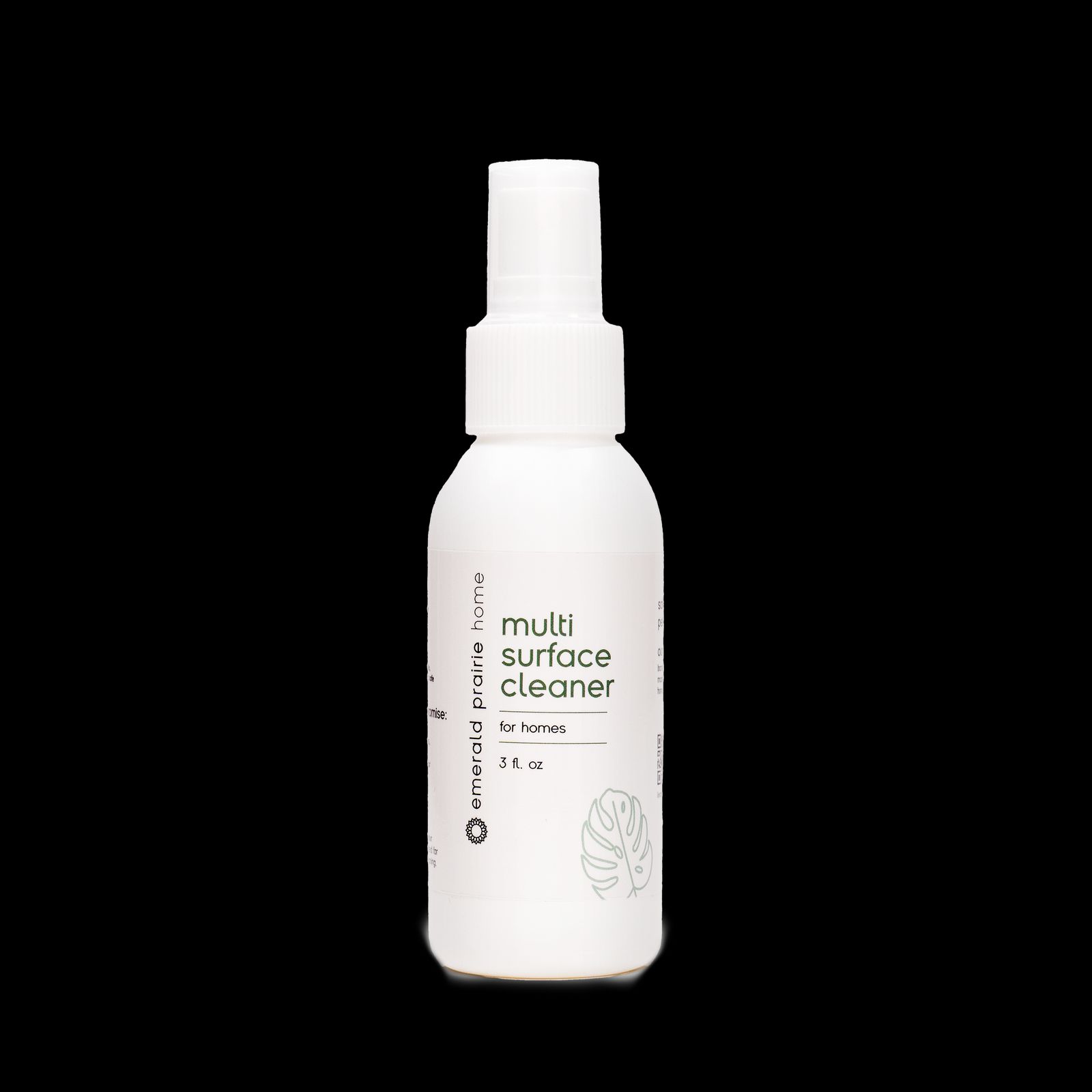 a bottle of multi surface cleaner on a black background