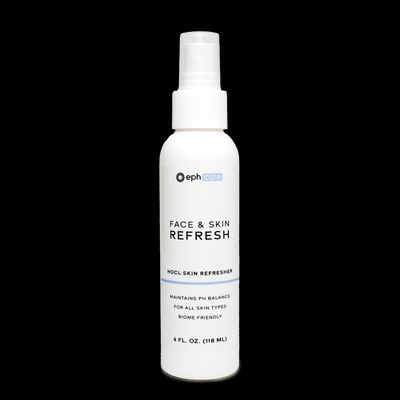 a bottle of face and skin refreshant on a black background