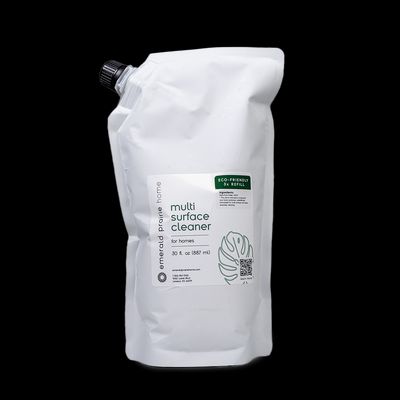 a white bag of coffee sitting on top of a black table