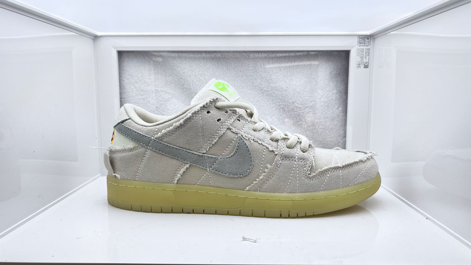 a pair of nike sneakers in a display case