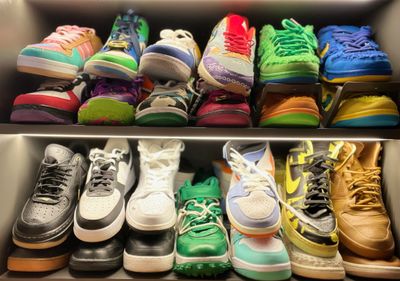 a bunch of shoes that are on a shelf