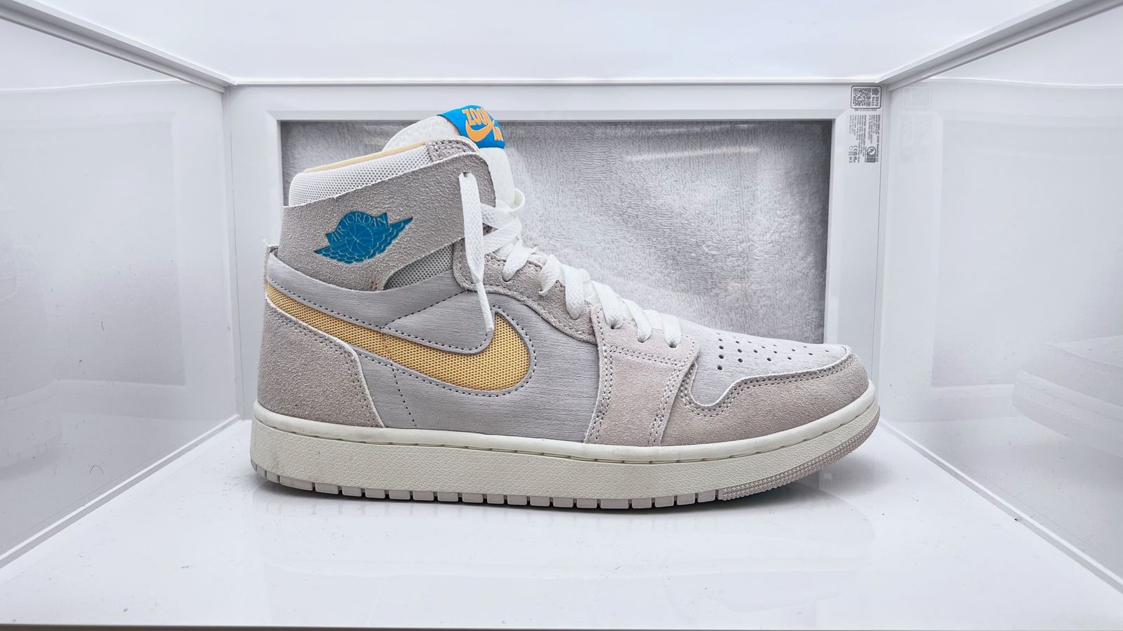 a pair of sneakers in a display case