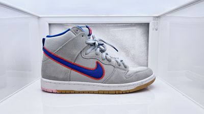 a pair of nike shoes in a white box