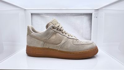 a white nike air force sneakers in a display case