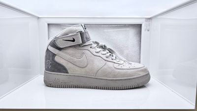 a pair of nike air force sneakers in a display case